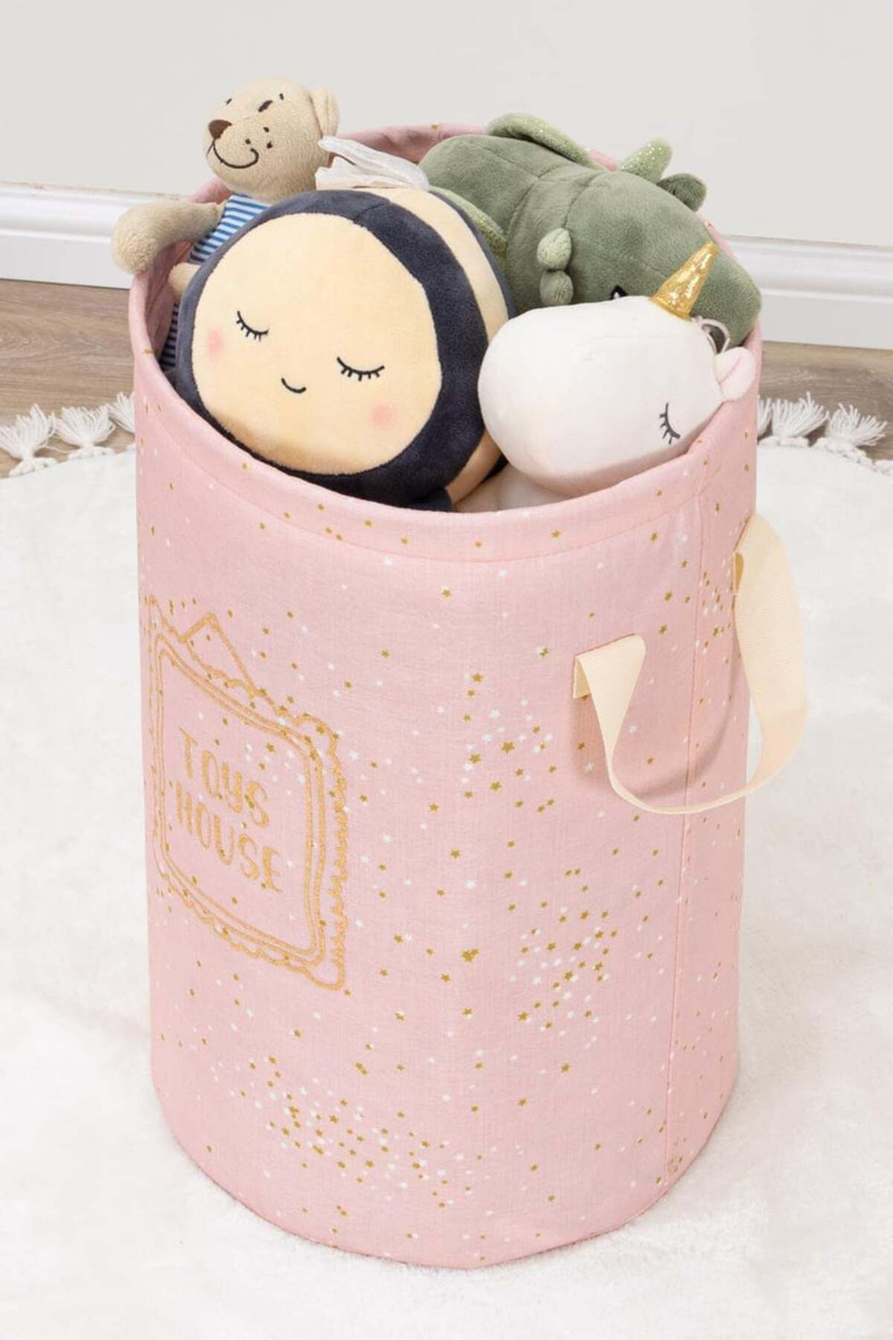 Pembe yıldız desenli oyuncak kutusunda peluş ayıcık, arı, dinozor ve unicorn oyuncaklar