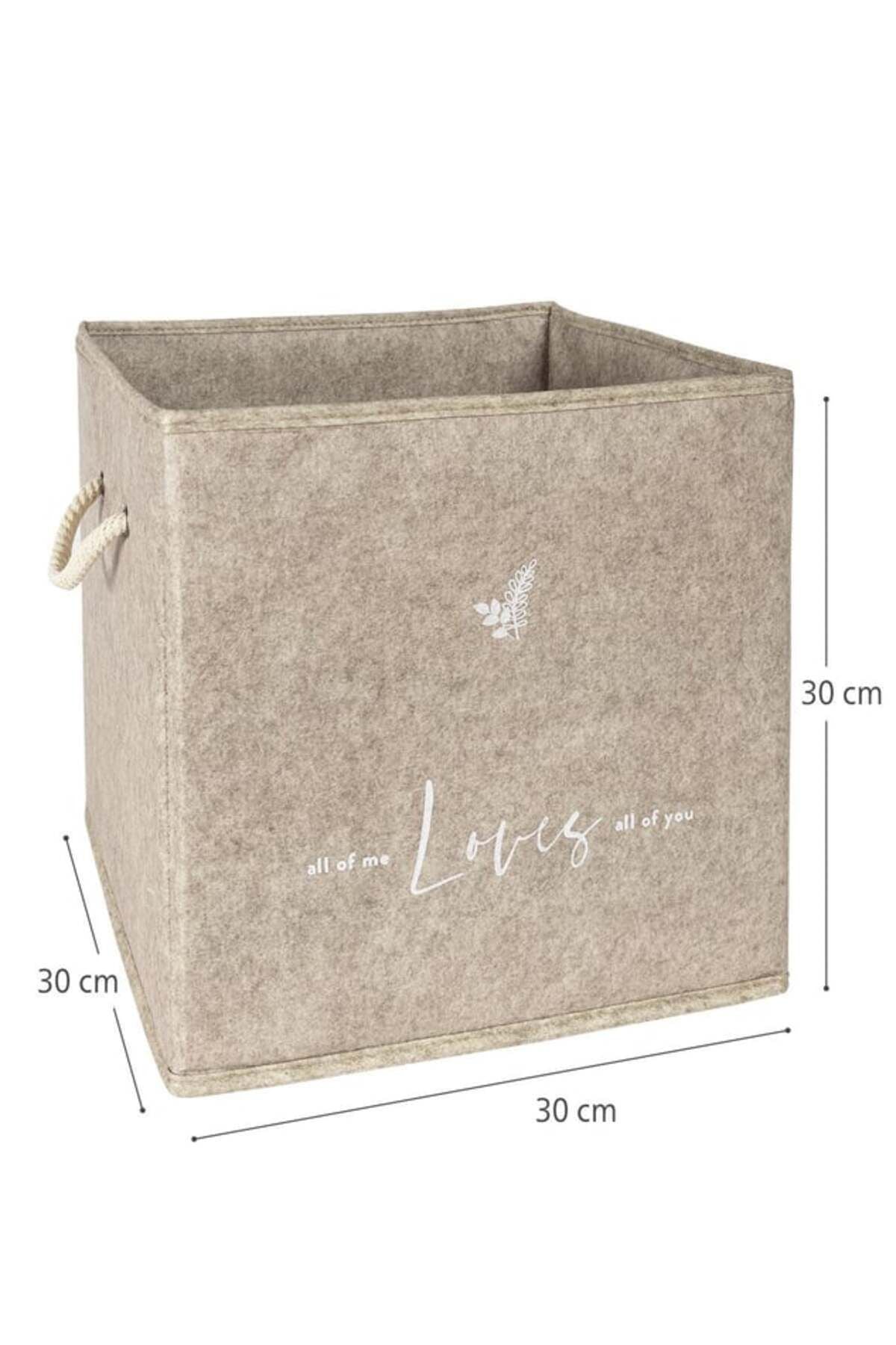 30x30x30 cm ölçülerinde bej renkli saklama kutusu, önünde 'Loves' yazısı ve yaprak deseni