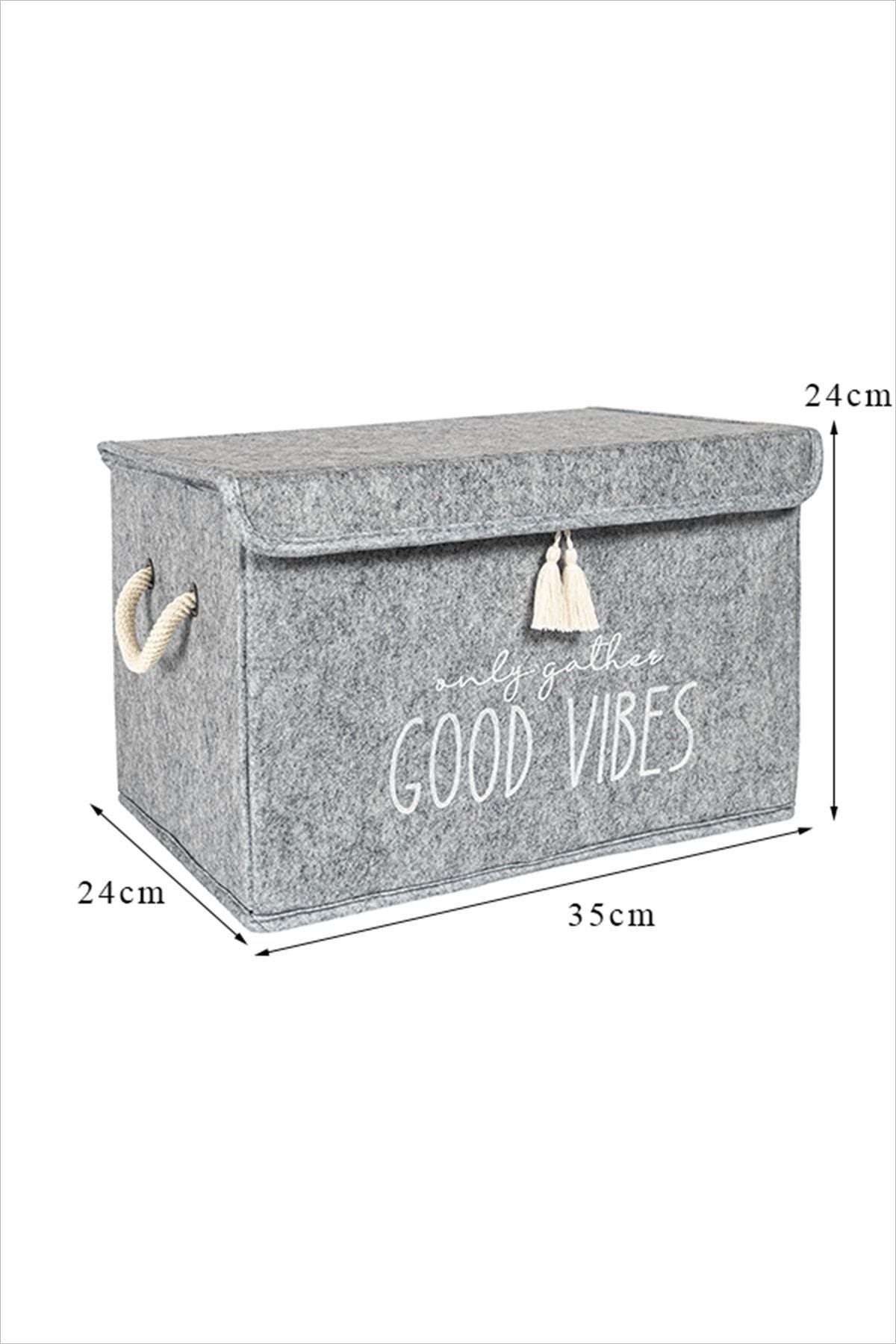 İçinde 'Good Vibes' yazan gri saklama kutusu, 35x24x24 cm boyutlarında, etrafında ip kulplar